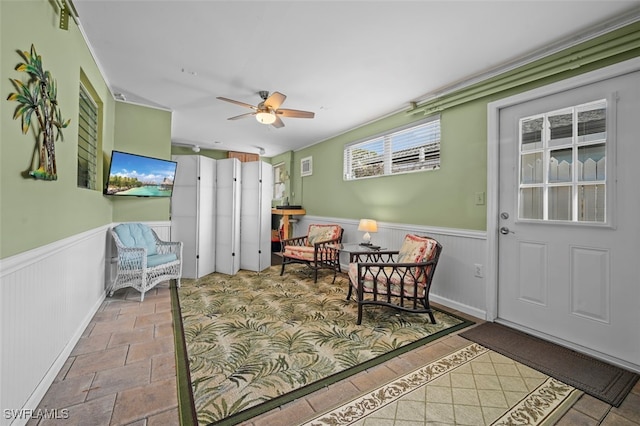 living area featuring ceiling fan