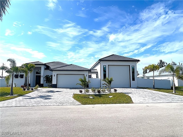 view of front of house with a front lawn and a garage