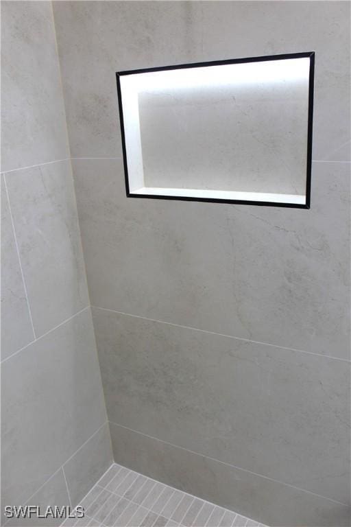 interior space featuring a tile shower