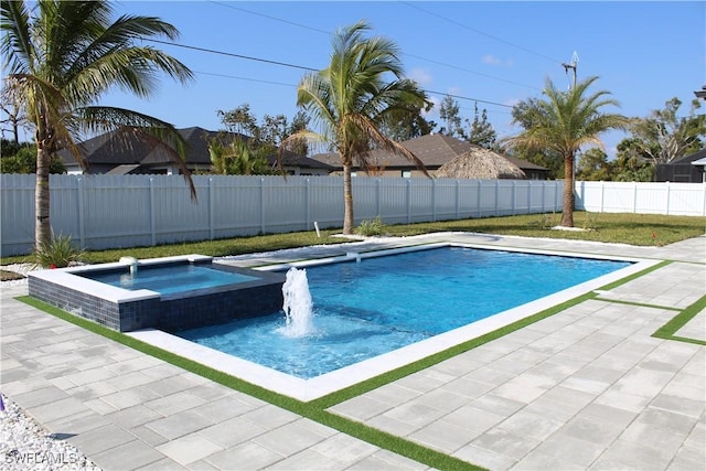 view of swimming pool with an in ground hot tub