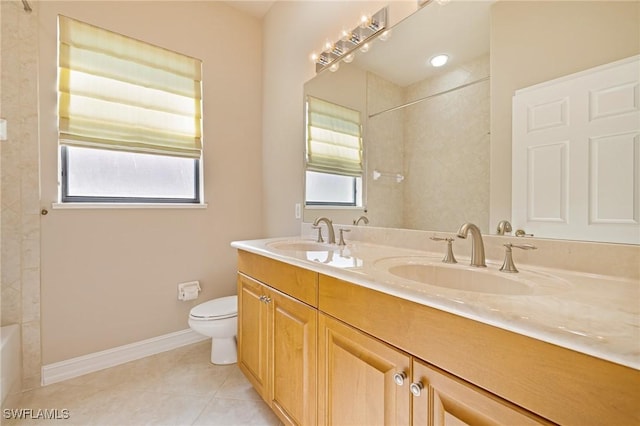 9284 Trieste Dr, Fort Myers, FL 33913 - bathroom featuring baseboards, a sink, toilet, and tile patterned flooring