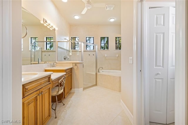 9284 Trieste Dr, Fort Myers, FL 33913 - full bath with double vanity, ceiling fan, a sink, a stall shower, and a garden tub