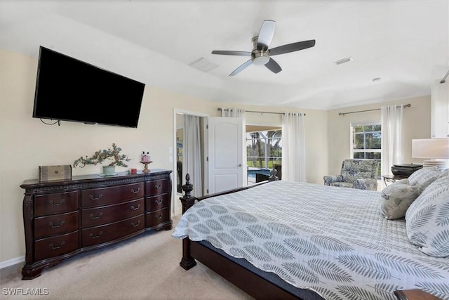 bedroom featuring light colored carpet, access to exterior, and ceiling fan