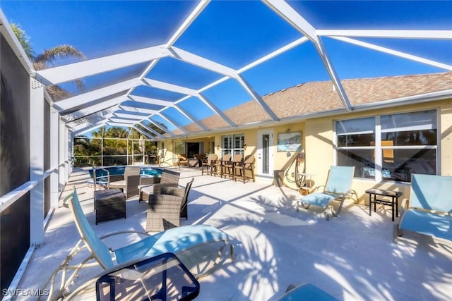 view of patio / terrace featuring a lanai