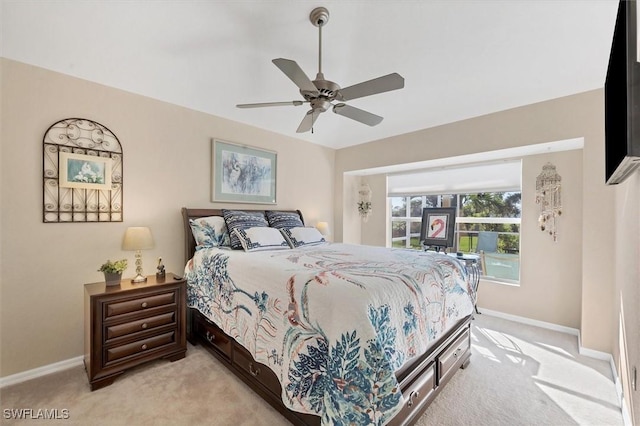 bedroom featuring ceiling fan and light colored carpet