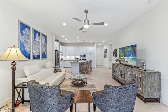 living room with ceiling fan