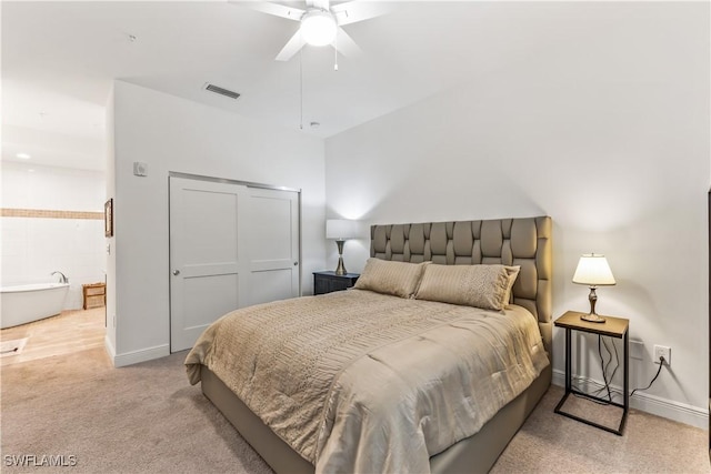 carpeted bedroom featuring ceiling fan and a closet