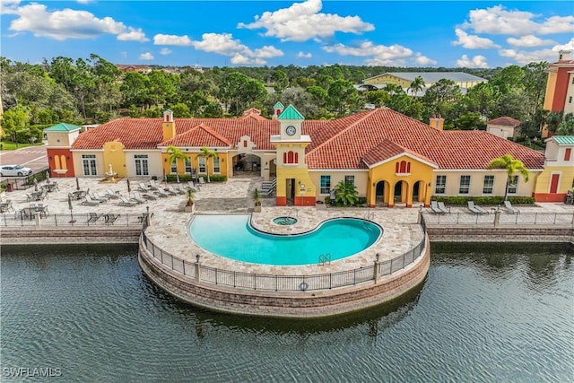 exterior space featuring a water view and a patio area