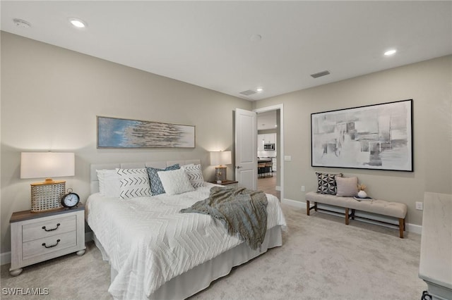 bedroom featuring light colored carpet