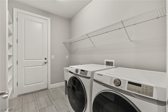 laundry room with independent washer and dryer