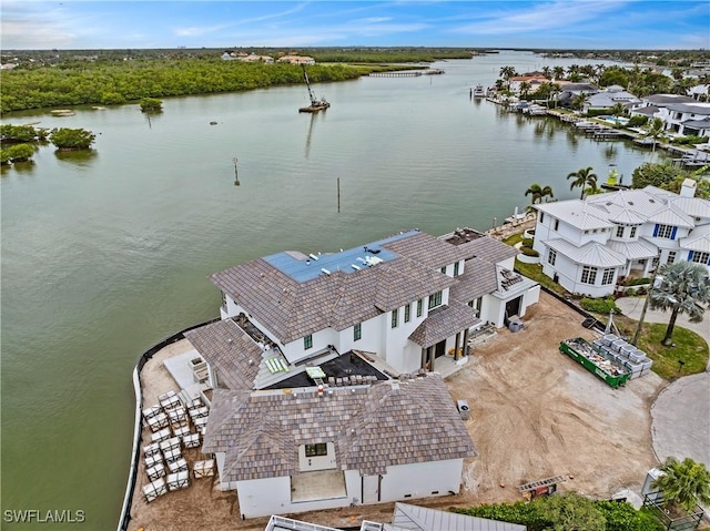 drone / aerial view with a water view