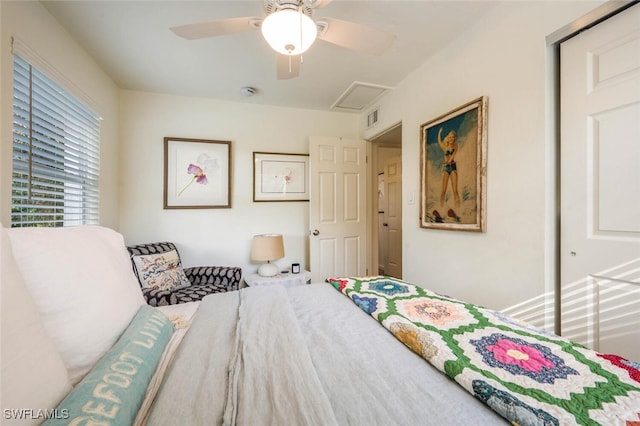 bedroom with ceiling fan and a closet