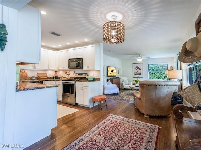 kitchen featuring ceiling fan, electric stove, white cabinets, and dark hardwood / wood-style floors