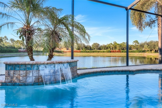 view of pool with pool water feature and a water view