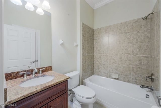 full bathroom featuring toilet, tiled shower / bath combo, vanity, and crown molding