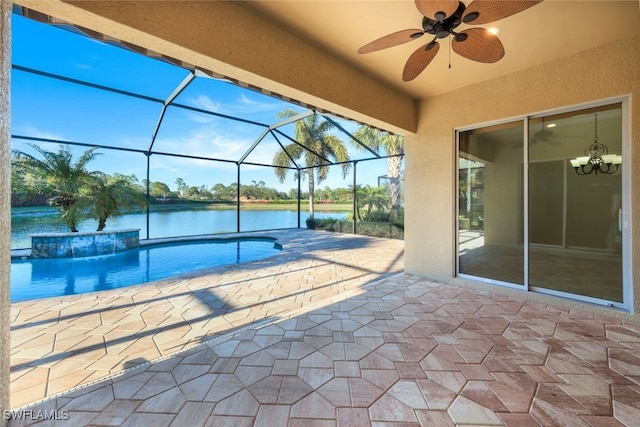 view of pool featuring glass enclosure, ceiling fan, pool water feature, a water view, and a patio