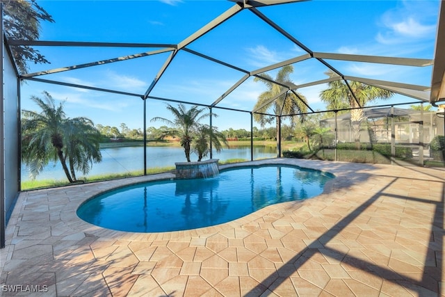 view of pool featuring a lanai, a water view, a patio area, and pool water feature