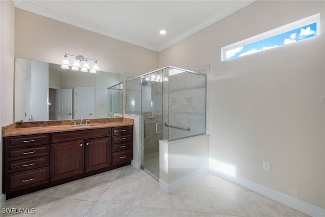 bathroom with vanity, tile patterned flooring, crown molding, and a shower with door