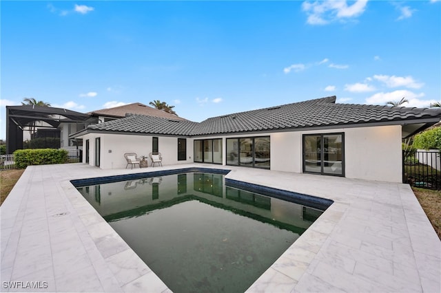 view of swimming pool with a lanai and a patio area