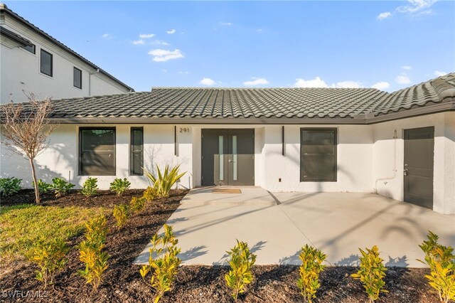 back of property featuring a patio area