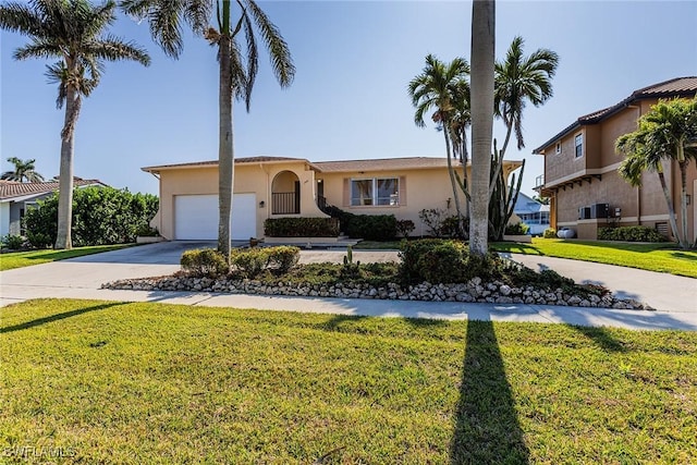 view of front of house featuring a front yard and a garage