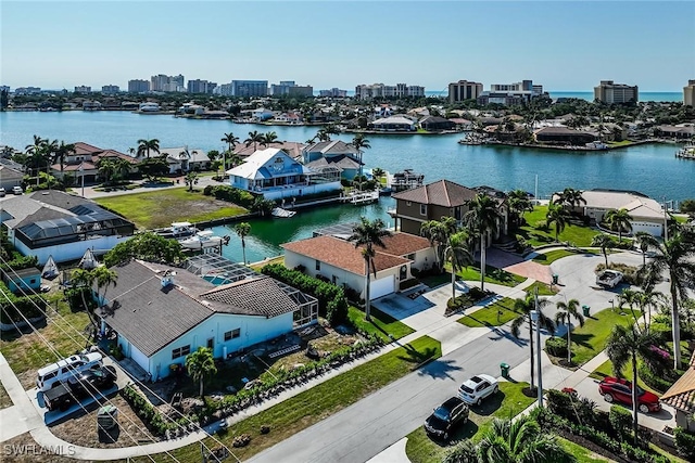 birds eye view of property with a water view