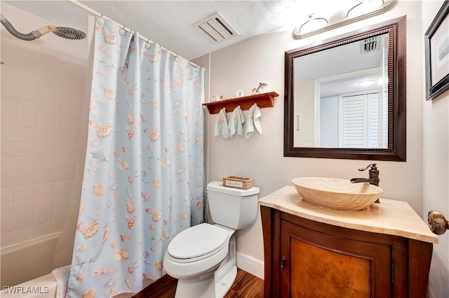 full bathroom with hardwood / wood-style flooring, vanity, toilet, and shower / bath combo