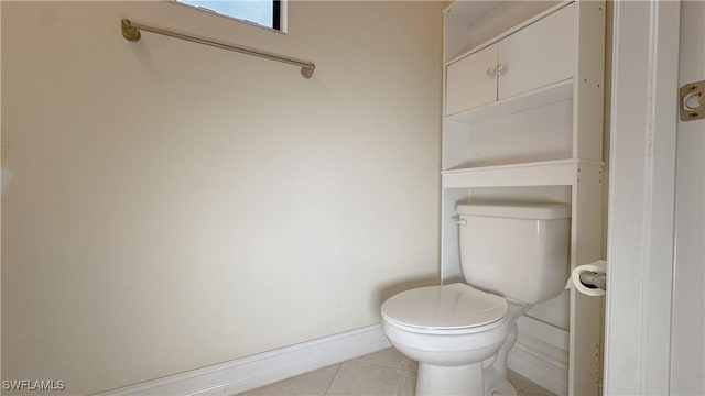 bathroom with tile patterned floors and toilet