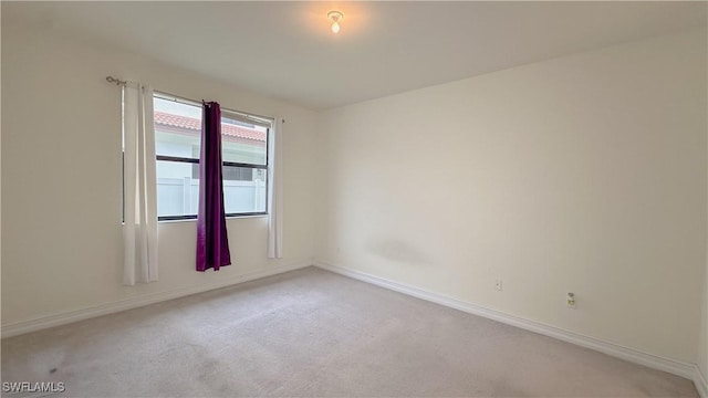 empty room with carpet flooring