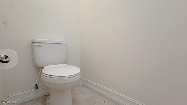 bathroom featuring toilet and tile patterned floors