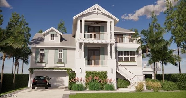 view of front of property featuring driveway, a garage, a balcony, ceiling fan, and stairs