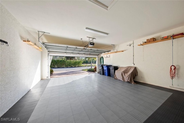 garage featuring a garage door opener