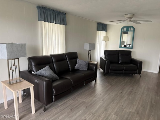 living room with hardwood / wood-style floors and ceiling fan