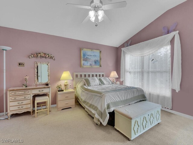 bedroom featuring light carpet, vaulted ceiling, and ceiling fan