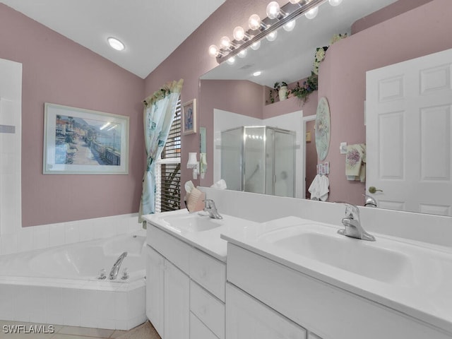 bathroom with vanity, separate shower and tub, and lofted ceiling