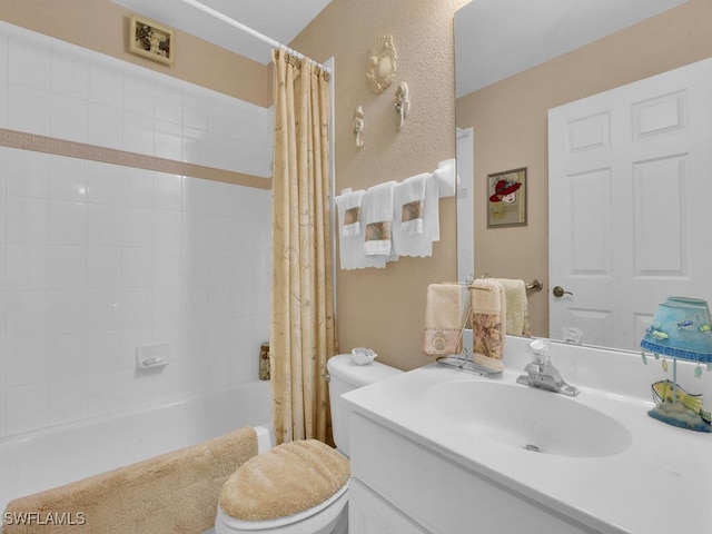 full bathroom with toilet, shower / bath combo with shower curtain, and vanity