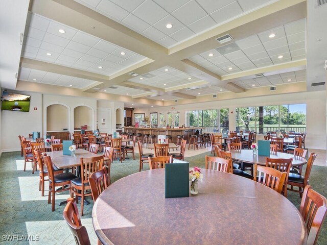 dining area with coffered ceiling, a paneled ceiling, and beam ceiling