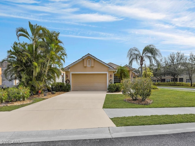 view of front facade with a front yard, stucco siding, an attached garage, and concrete driveway