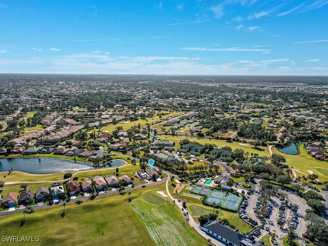 aerial view featuring a water view, a residential view, and golf course view