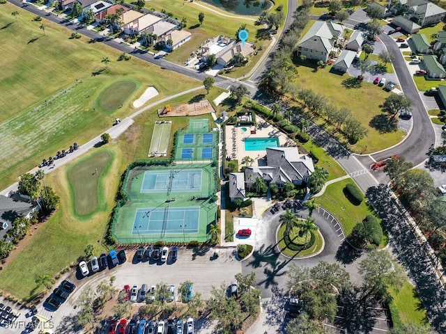 birds eye view of property with golf course view