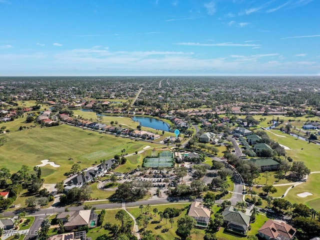 aerial view with a water view, view of golf course, and a residential view