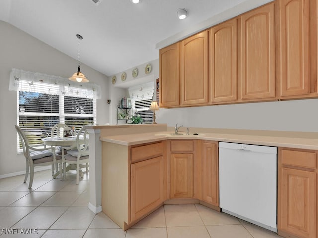 kitchen with light brown cabinets, vaulted ceiling, light tile patterned floors, and dishwasher