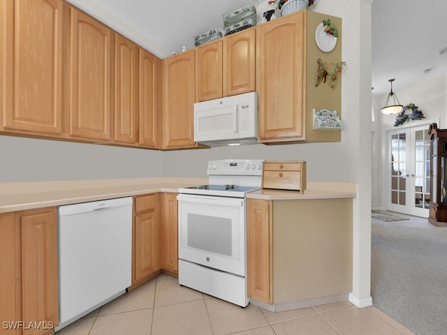 kitchen featuring light countertops, light colored carpet, white appliances, light tile patterned floors, and light brown cabinets