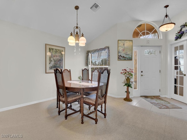 carpeted dining area featuring tile patterned floors, a notable chandelier, baseboards, and visible vents