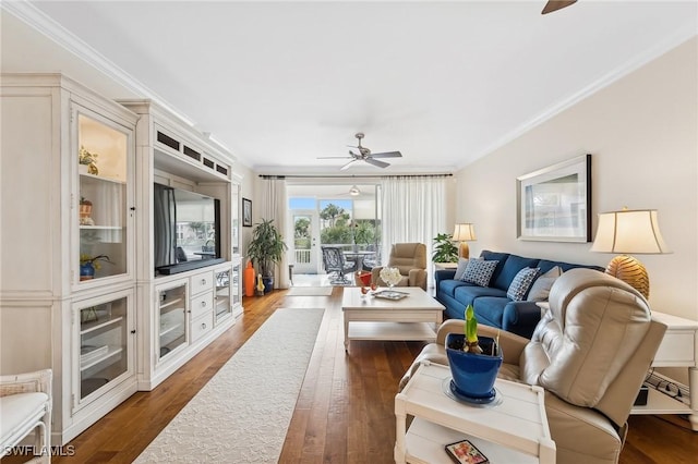 living room with ceiling fan, crown molding, and dark hardwood / wood-style floors