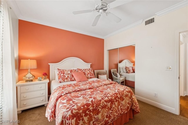 bedroom with carpet floors, ceiling fan, and ornamental molding