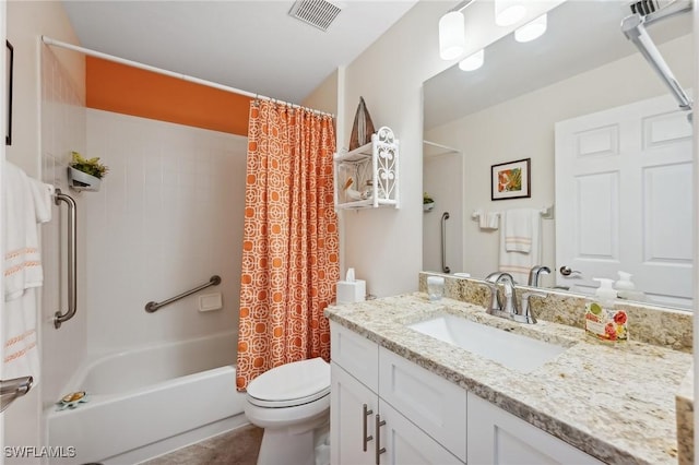 full bathroom featuring shower / tub combo, vanity, and toilet