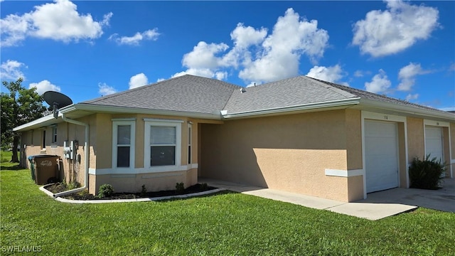 exterior space featuring a front yard and a garage