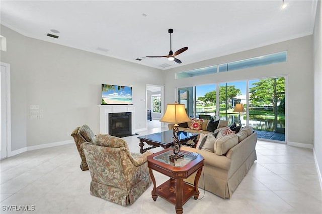 living room featuring a fireplace and ceiling fan