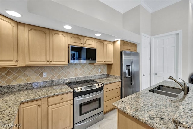 kitchen featuring sink, stainless steel appliances, backsplash, and light brown cabinets